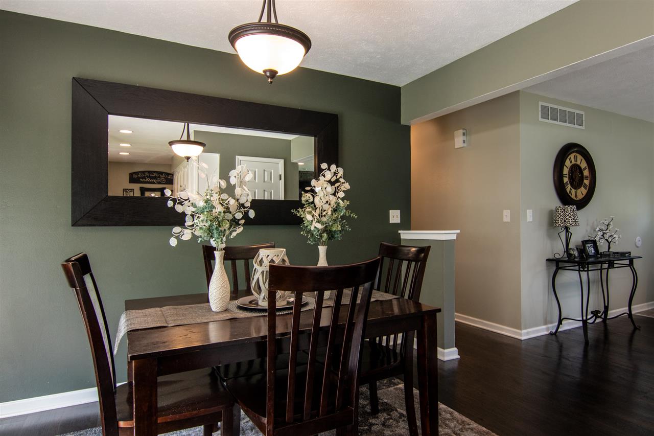 5780 Rural Edge Drive Roscoe, IL 61073 - Photo 7 of 25 a view of a dining room with furniture and wooden floor