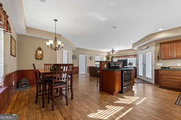 a kitchen with stainless steel appliances granite countertop a refrigerator sink and cabinets