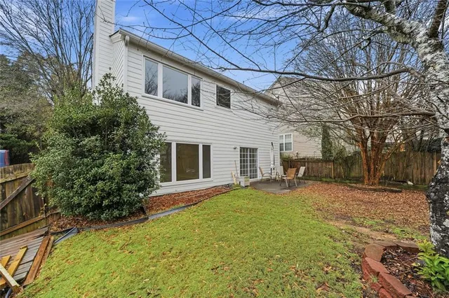 a view of a yard with a patio