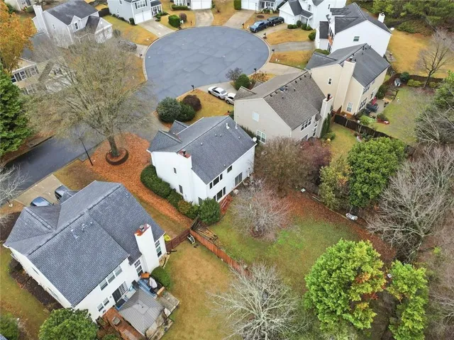 an aerial view of residential houses with outdoor space