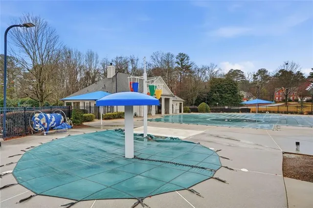 a view of a park with large trees