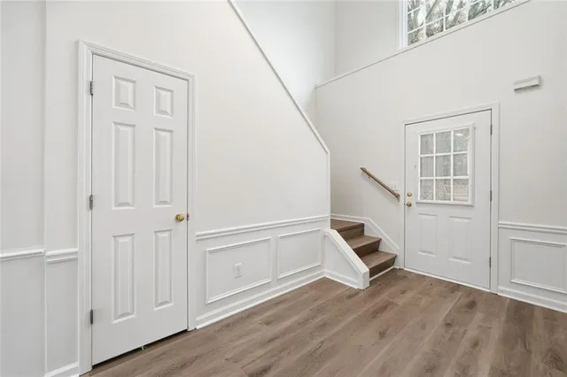 a view of an entryway with wooden floor
