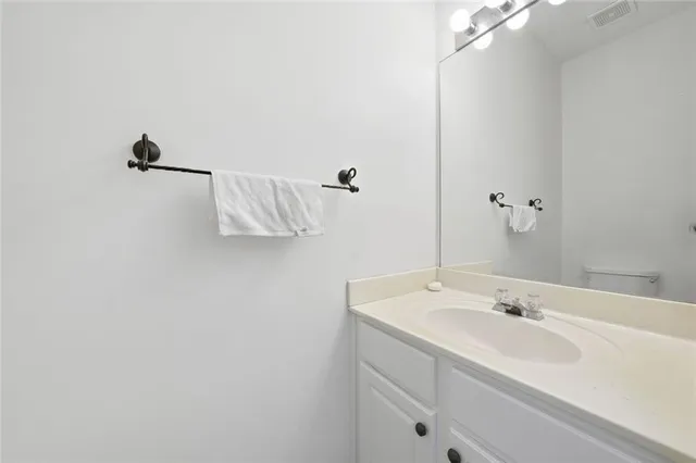 a bathroom with a sink and mirror
