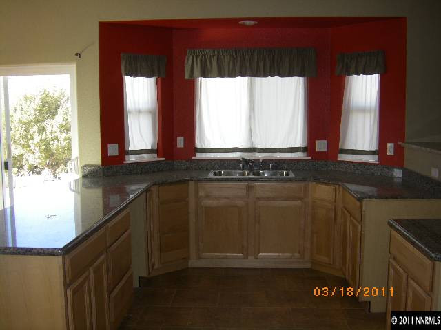 3500 Outback Lane Reno, NV 89510 - Photo 3 of 7 a bathroom with a sink and a window