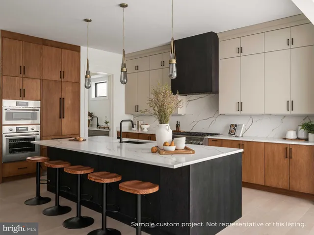 a kitchen with stainless steel appliances granite countertop a sink a stove and refrigerator