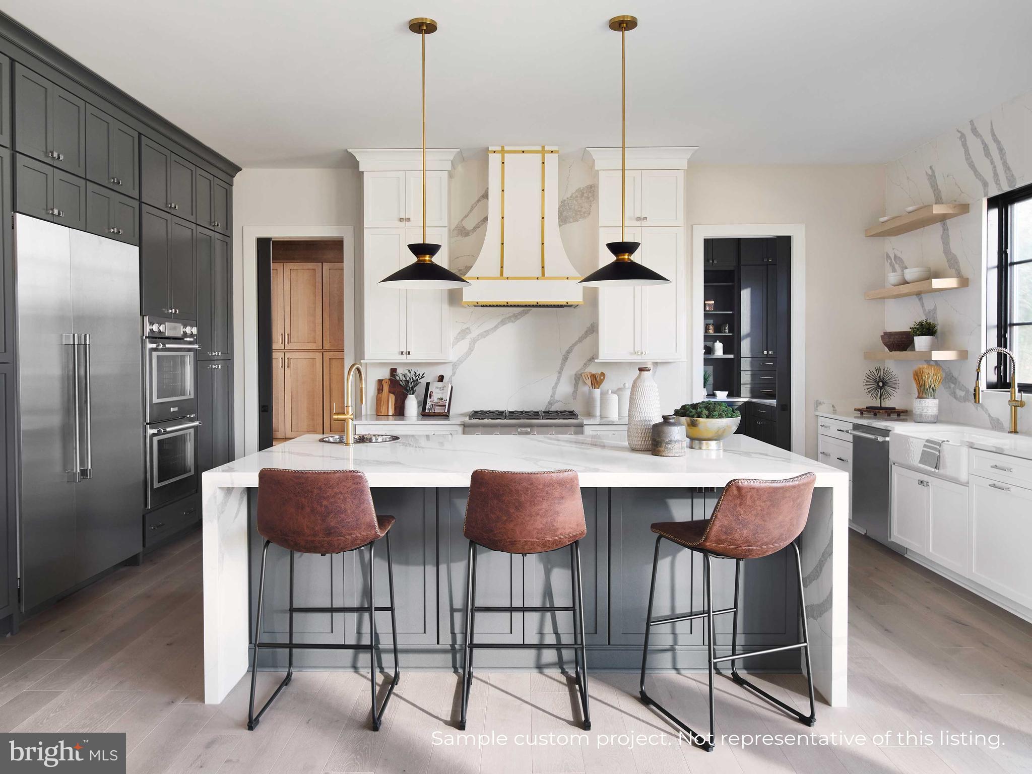 13017 Glen Road North Potomac, MD 20878 - Photo 6 of 28 a kitchen with granite countertop a table chairs stove and refrigerator