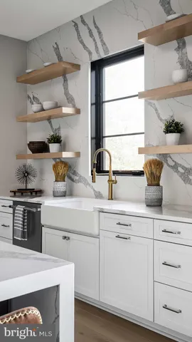 a kitchen with white cabinets and appliances