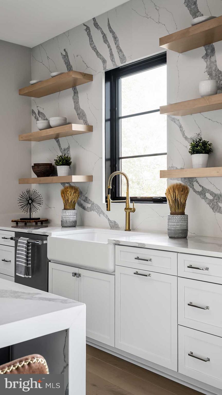 13017 Glen Road North Potomac, MD 20878 - Photo 9 of 28 a kitchen with white cabinets and appliances