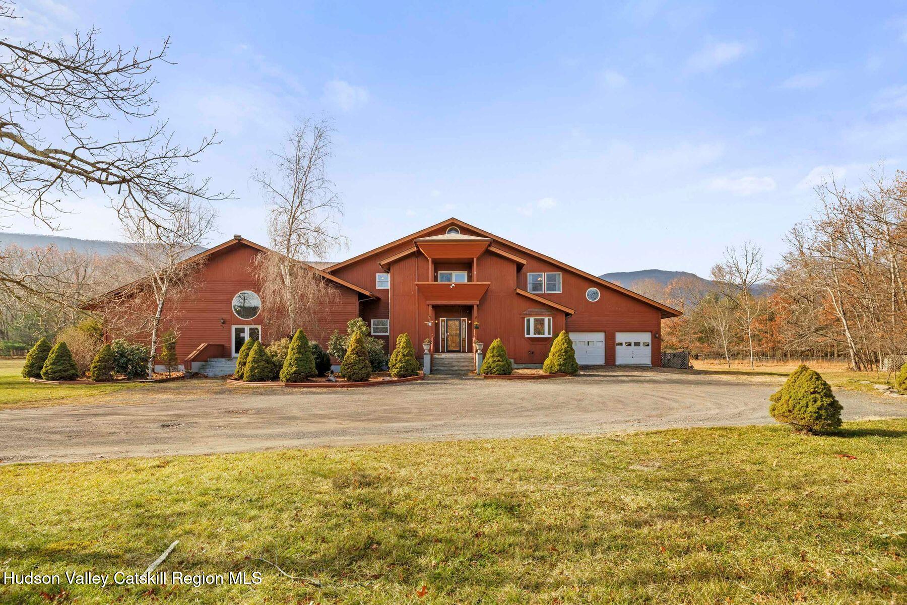 404 Winter Clove Road Round Top, NY 12473 - Photo 109 of 133 a front view of a house with a yard and large trees