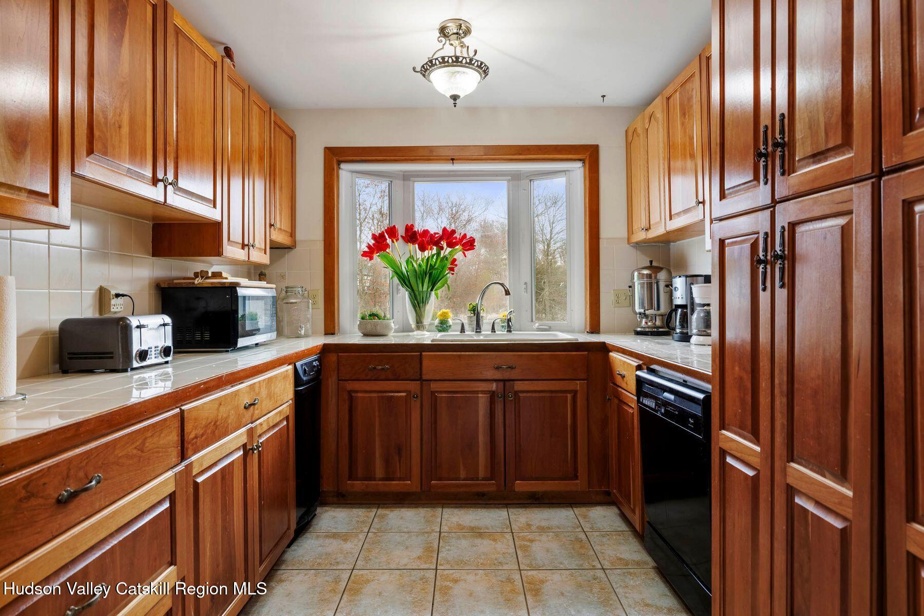 404 Winter Clove Road Round Top, NY 12473 - Photo 15 of 133 a kitchen with stainless steel appliances granite countertop a refrigerator and a sink