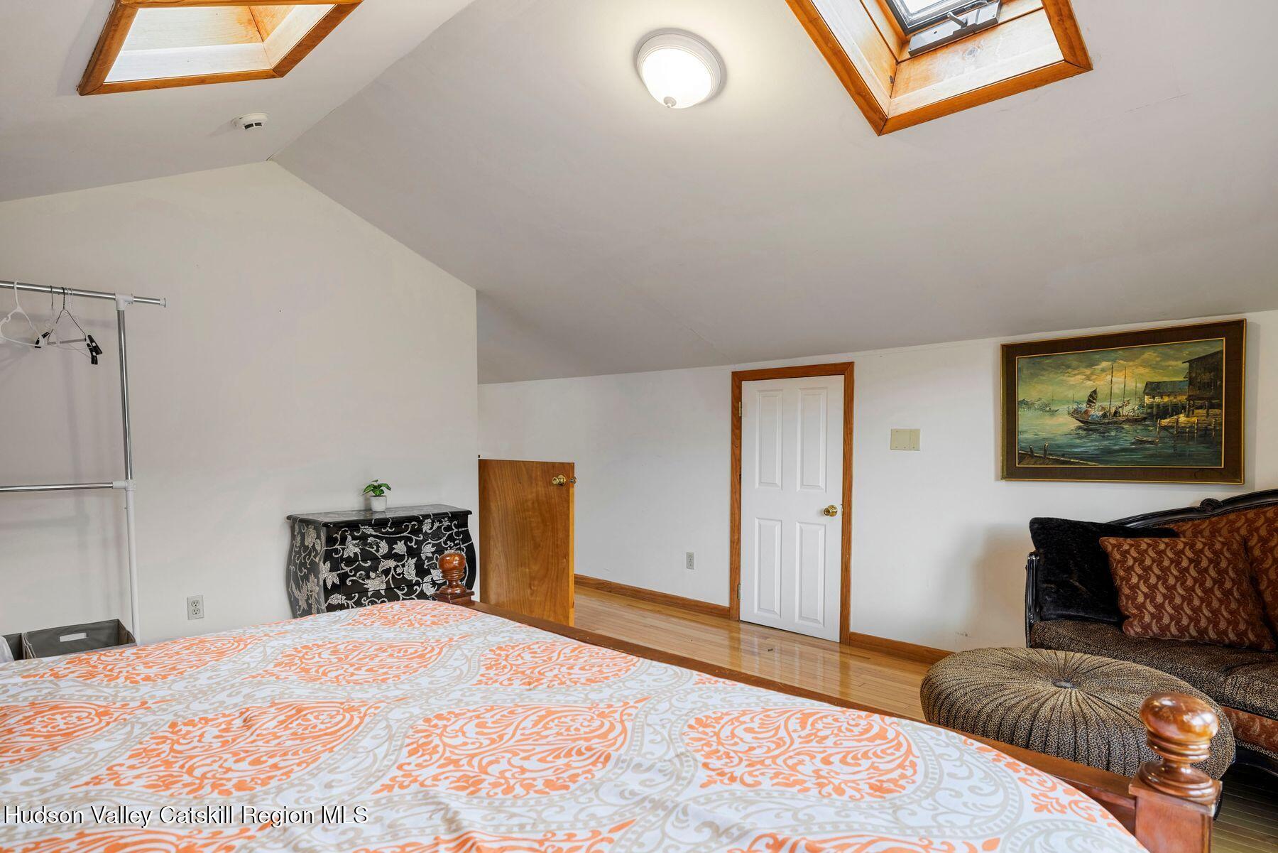 404 Winter Clove Road Round Top, NY 12473 - Photo 21 of 133 a bedroom with a bed and a couch