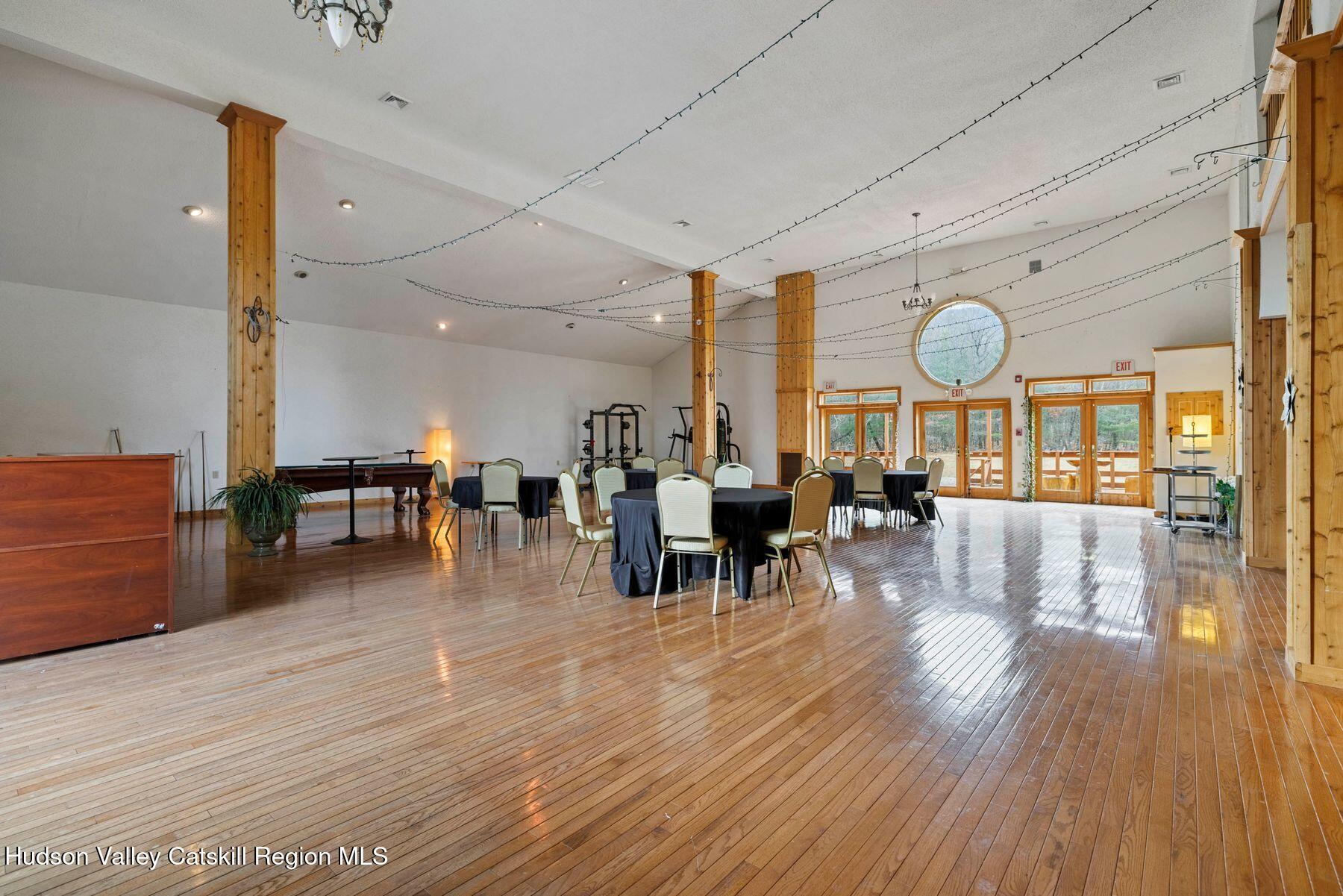 404 Winter Clove Road Round Top, NY 12473 - Photo 28 of 133 a living room with lots of furniture and wooden floors