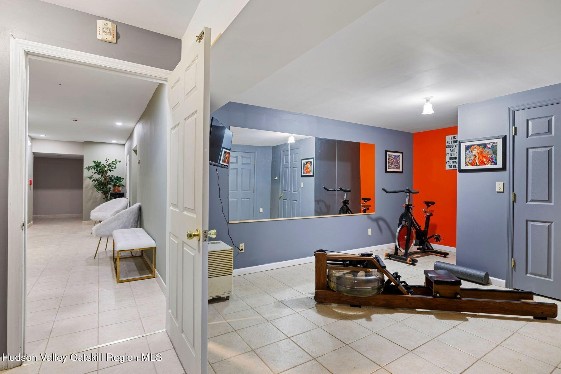 404 Winter Clove Road Round Top, NY 12473 - Photo 63 of 133 a room with gym equipment and view of living room