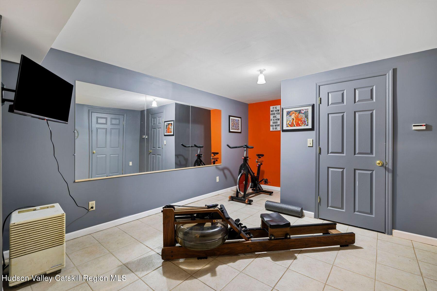 404 Winter Clove Road Round Top, NY 12473 - Photo 65 of 133 a living room with furniture and a flat screen tv