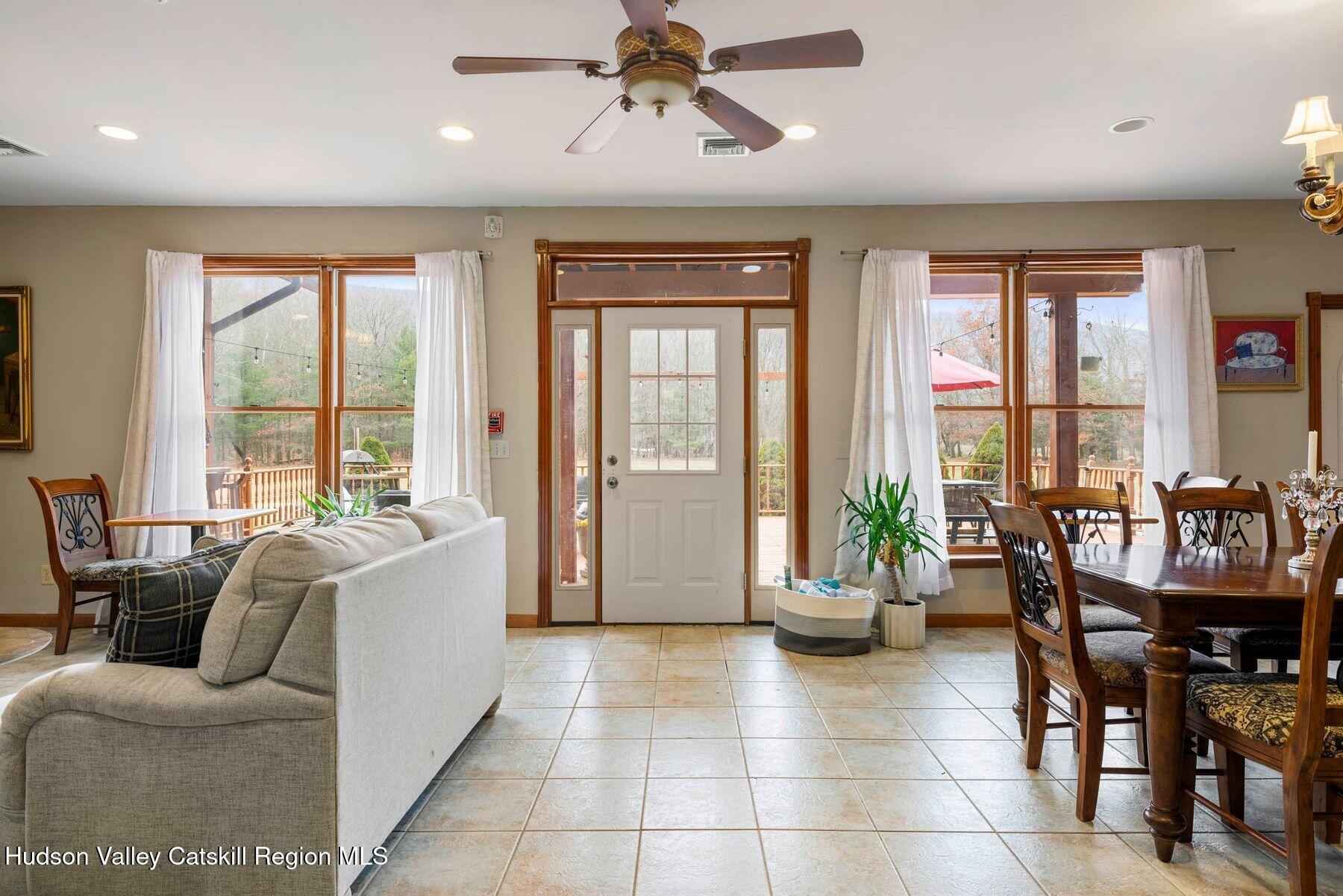 404 Winter Clove Road Round Top, NY 12473 - Photo 71 of 133 a living room with furniture and floor to ceiling windows