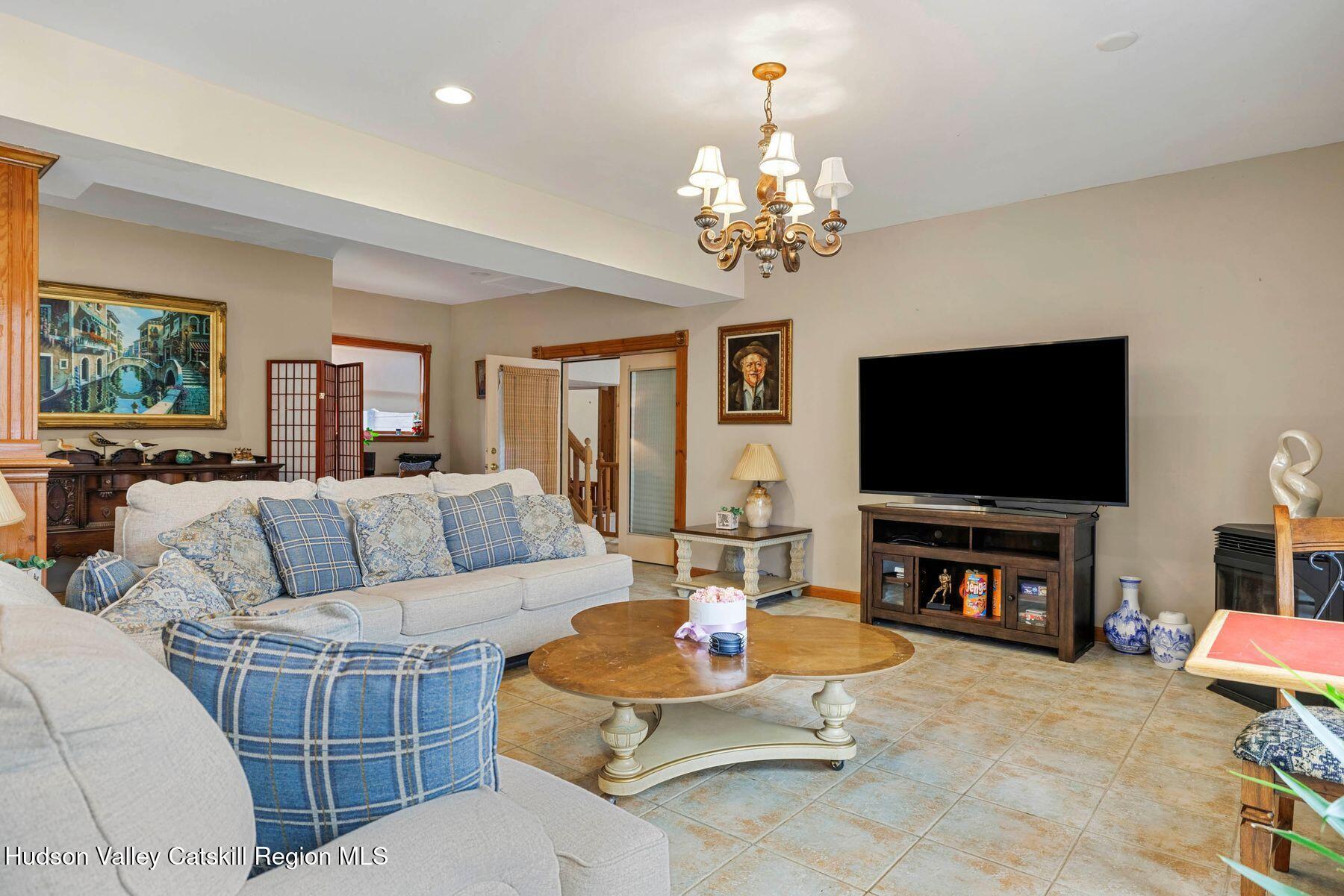 404 Winter Clove Road Round Top, NY 12473 - Photo 72 of 133 a living room with furniture and a flat screen tv