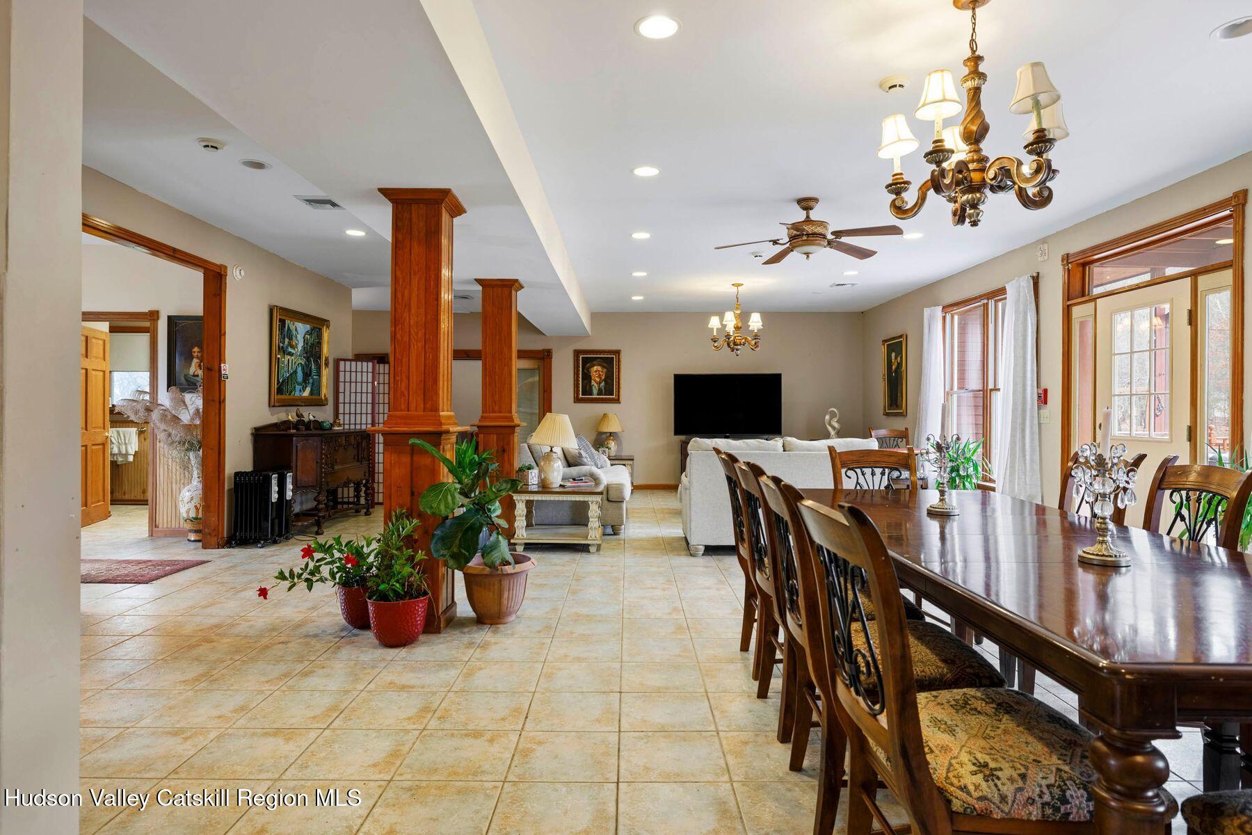 404 Winter Clove Road Round Top, NY 12473 - Photo 8 of 133 a view of a dining room with furniture window and outside view
