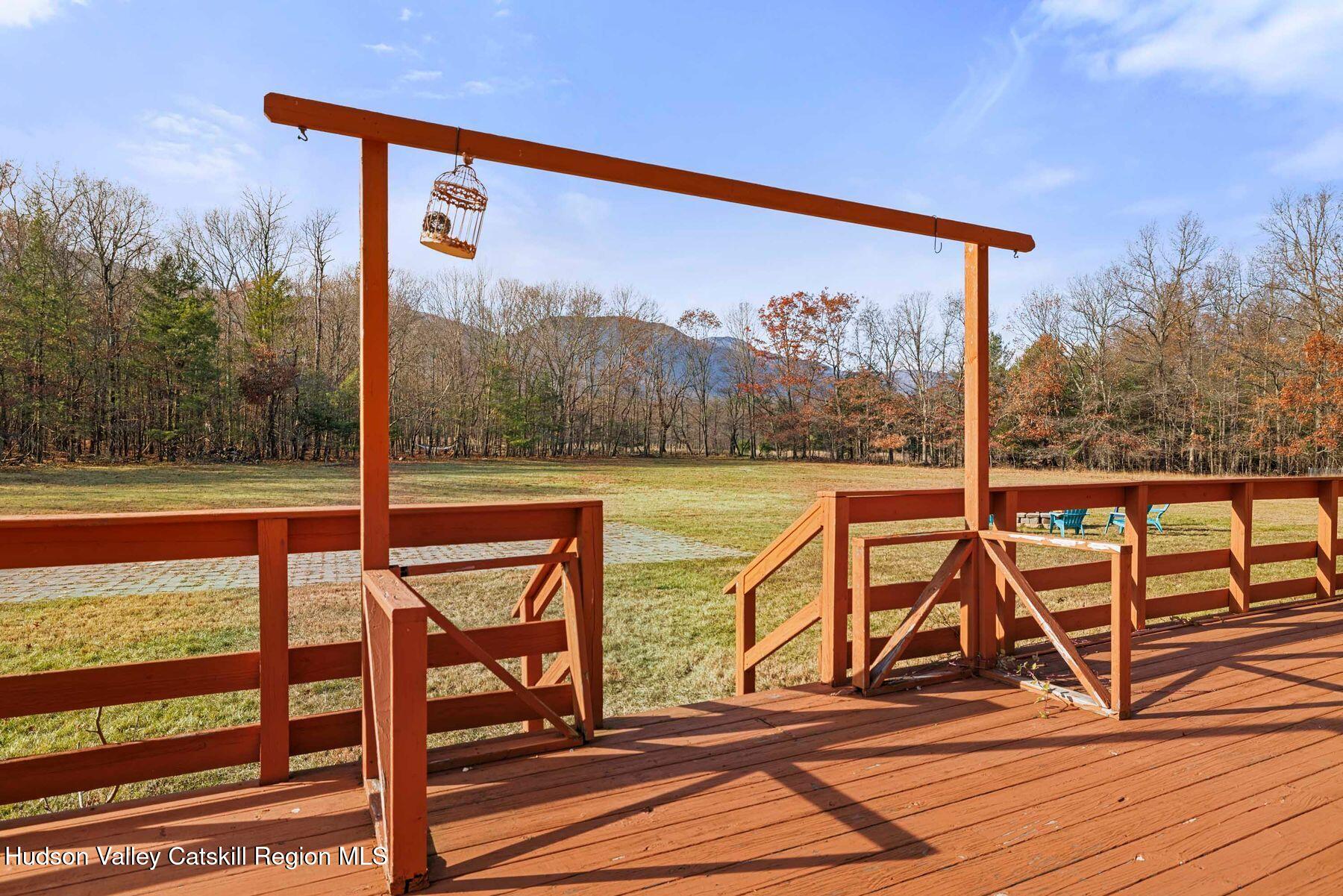404 Winter Clove Road Round Top, NY 12473 - Photo 85 of 133 a view of a balcony with chairs and wooden floor