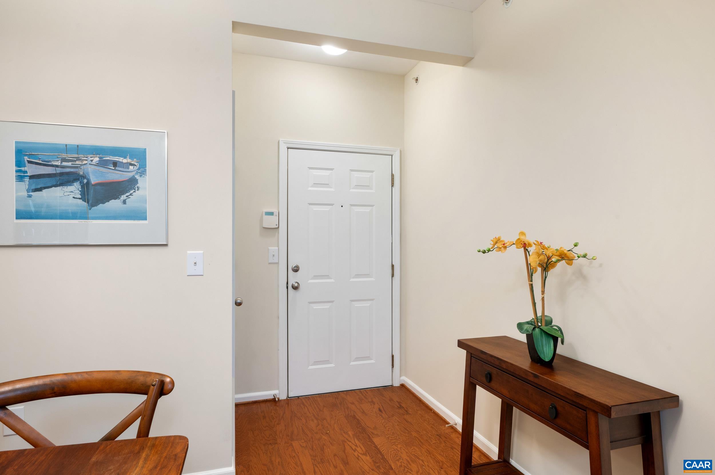 765 Walker Square, Unit 2D Charlottesville, VA 22903 - Photo 5 of 33 a view of a livingroom with furniture and a potted plant