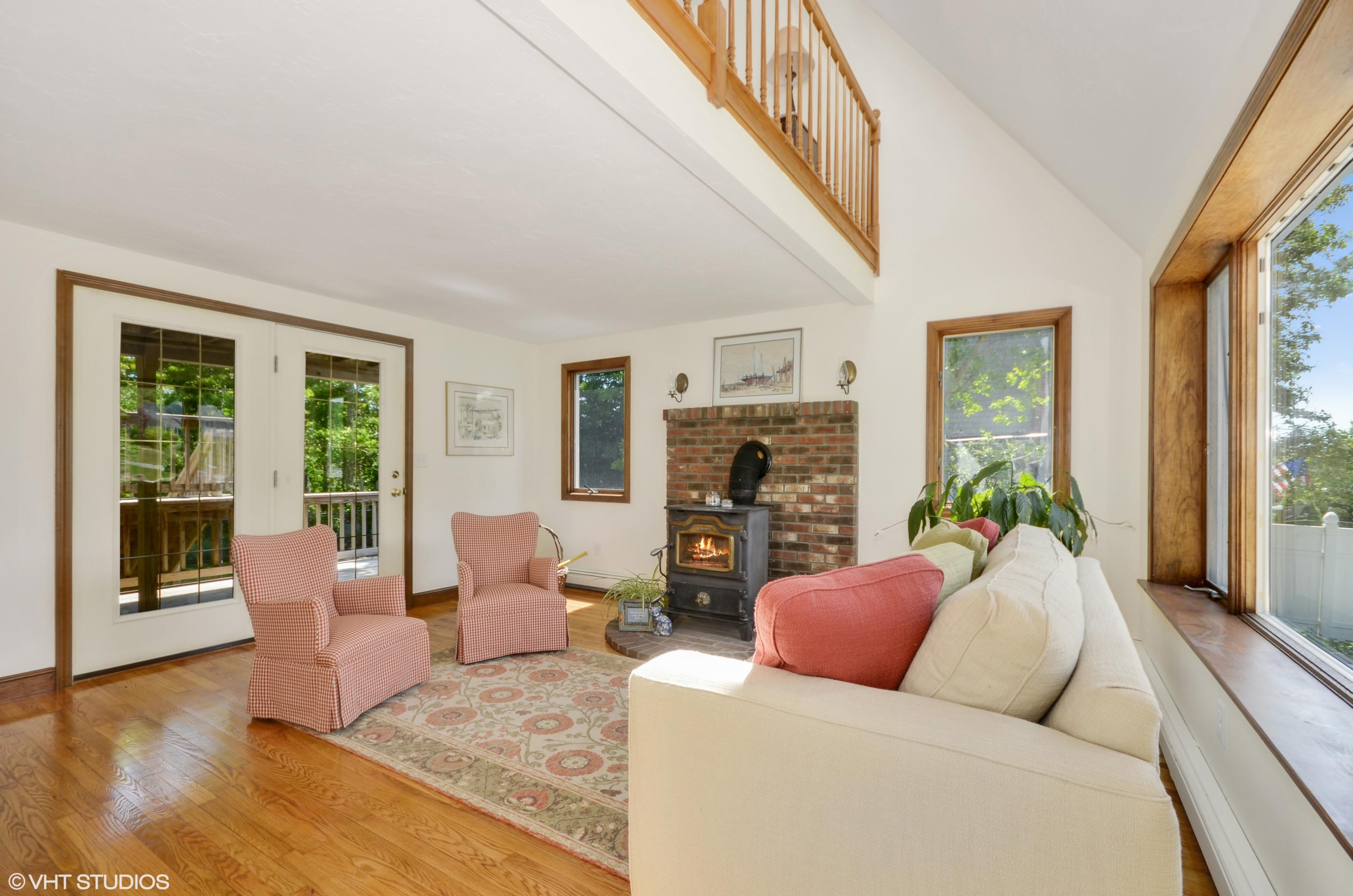 7 Brady Road Sagamore Beach, MA 02562 - Photo 2 of 15 a living room with furniture large window and a flat screen tv