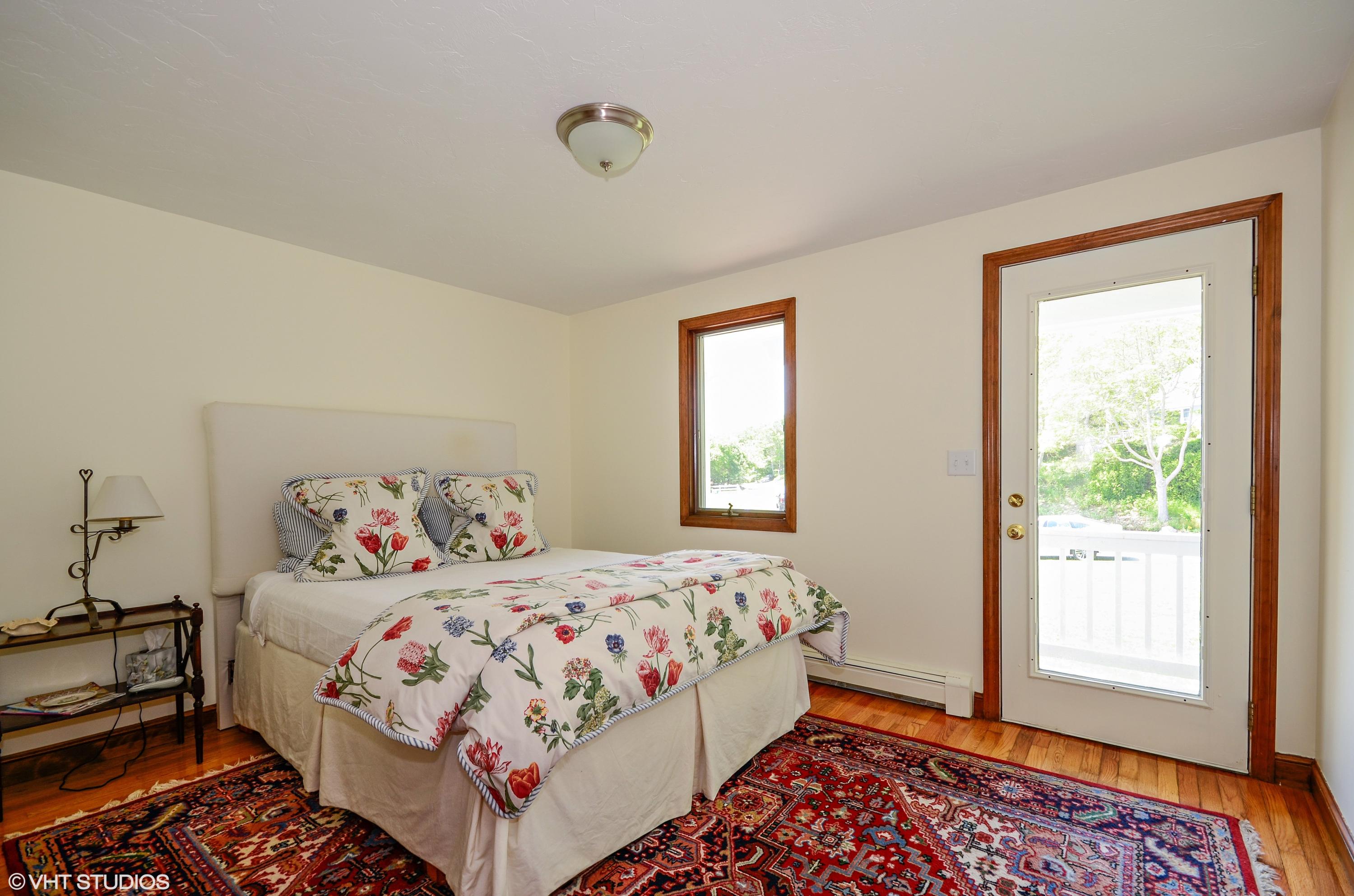 7 Brady Road Sagamore Beach, MA 02562 - Photo 8 of 15 a bedroom with a bed and a window