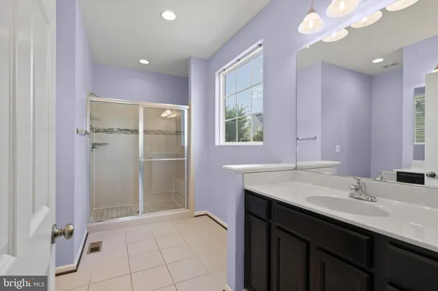 a bathroom with a sink a vanity and a mirror