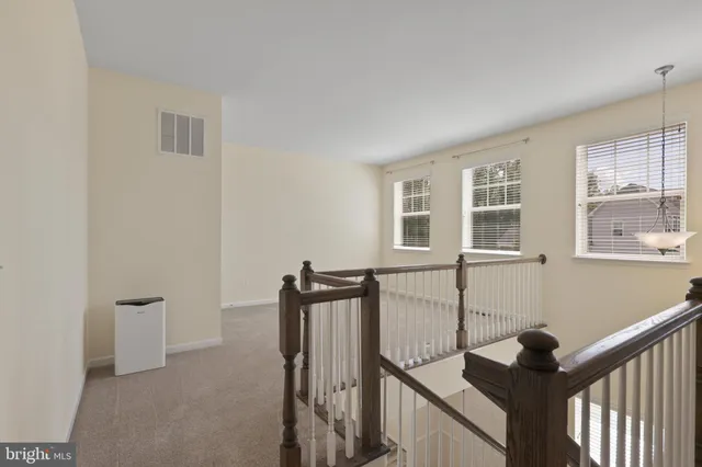 a view of a hallway with windows