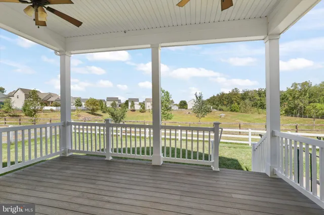 a view of a balcony with wooden floor