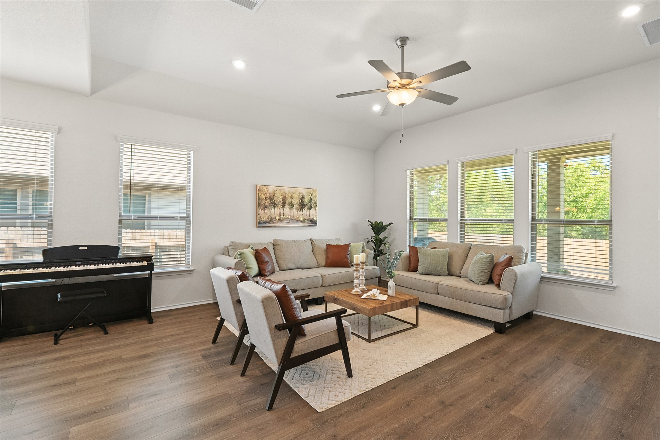 211 Brookside Street Hutto, TX 78634 - Photo 15 of 40 Living area featuring recessed lighting, dark wood finished floors, vaulted ceiling, and a ceiling fan