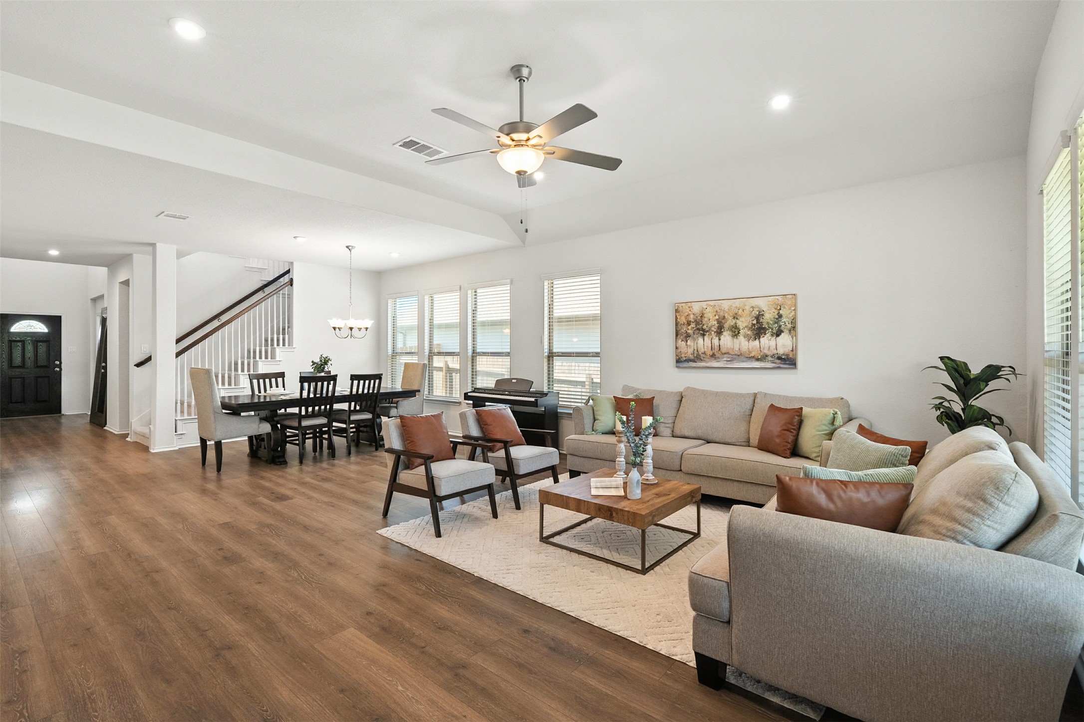 211 Brookside Street Hutto, TX 78634 - Photo 16 of 40 Living area with wood finished floors, recessed lighting, a ceiling fan, and stairway