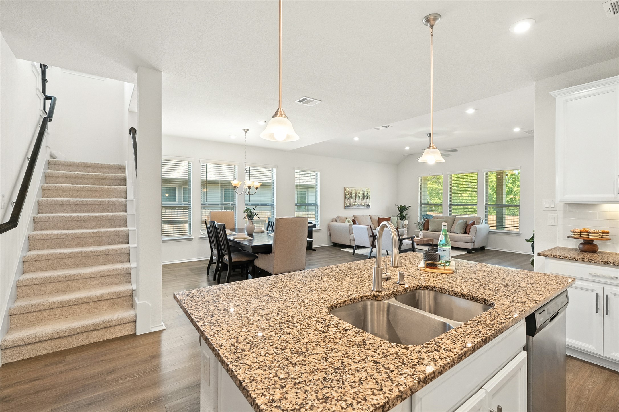 211 Brookside Street Hutto, TX 78634 - Photo 23 of 40 Kitchen with white cabinets, dark wood-style floors, decorative light fixtures, a chandelier, and recessed lighting