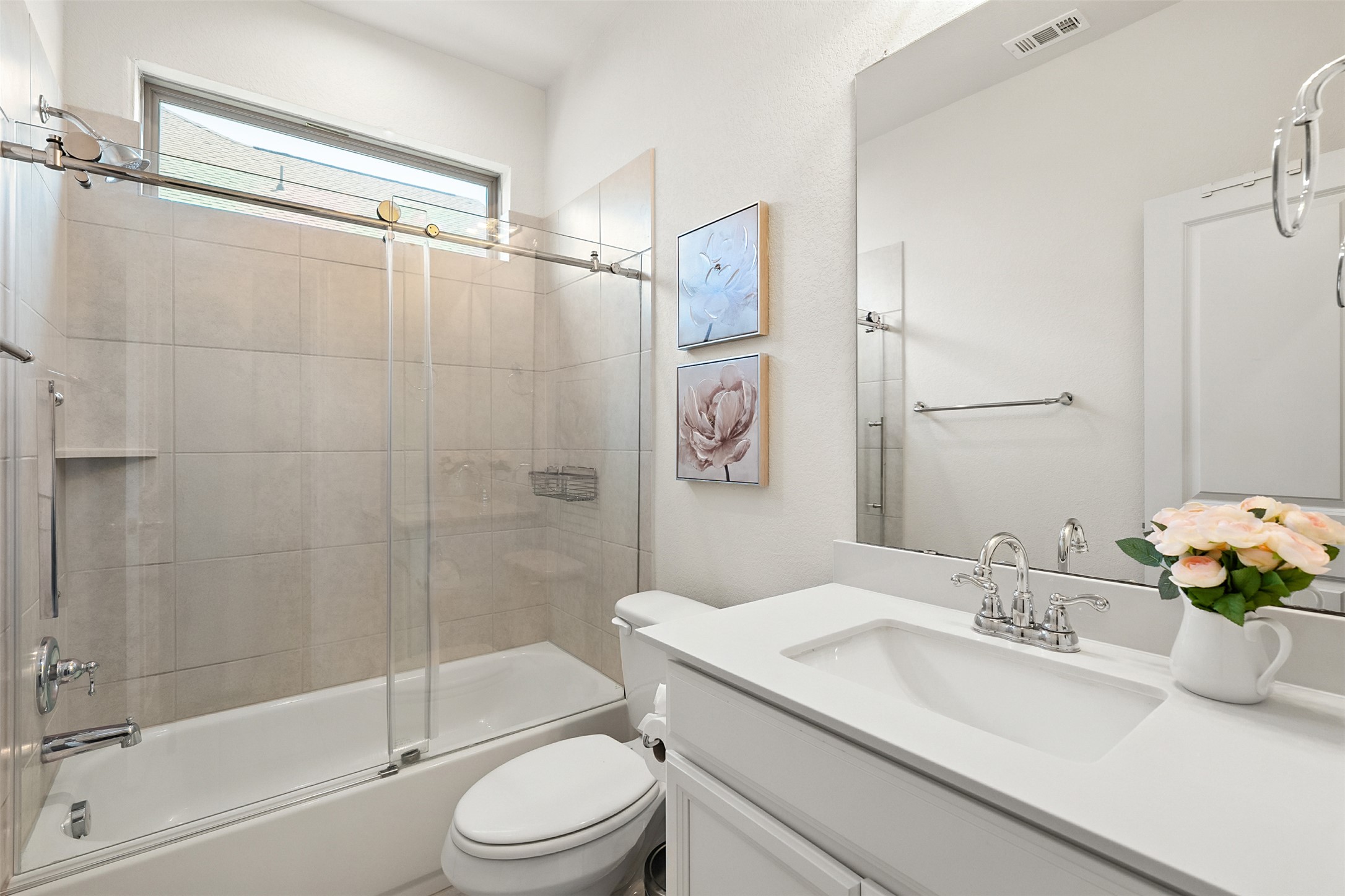 211 Brookside Street Hutto, TX 78634 - Photo 24 of 40 Bathroom featuring shower / bath combination with glass door and vanity