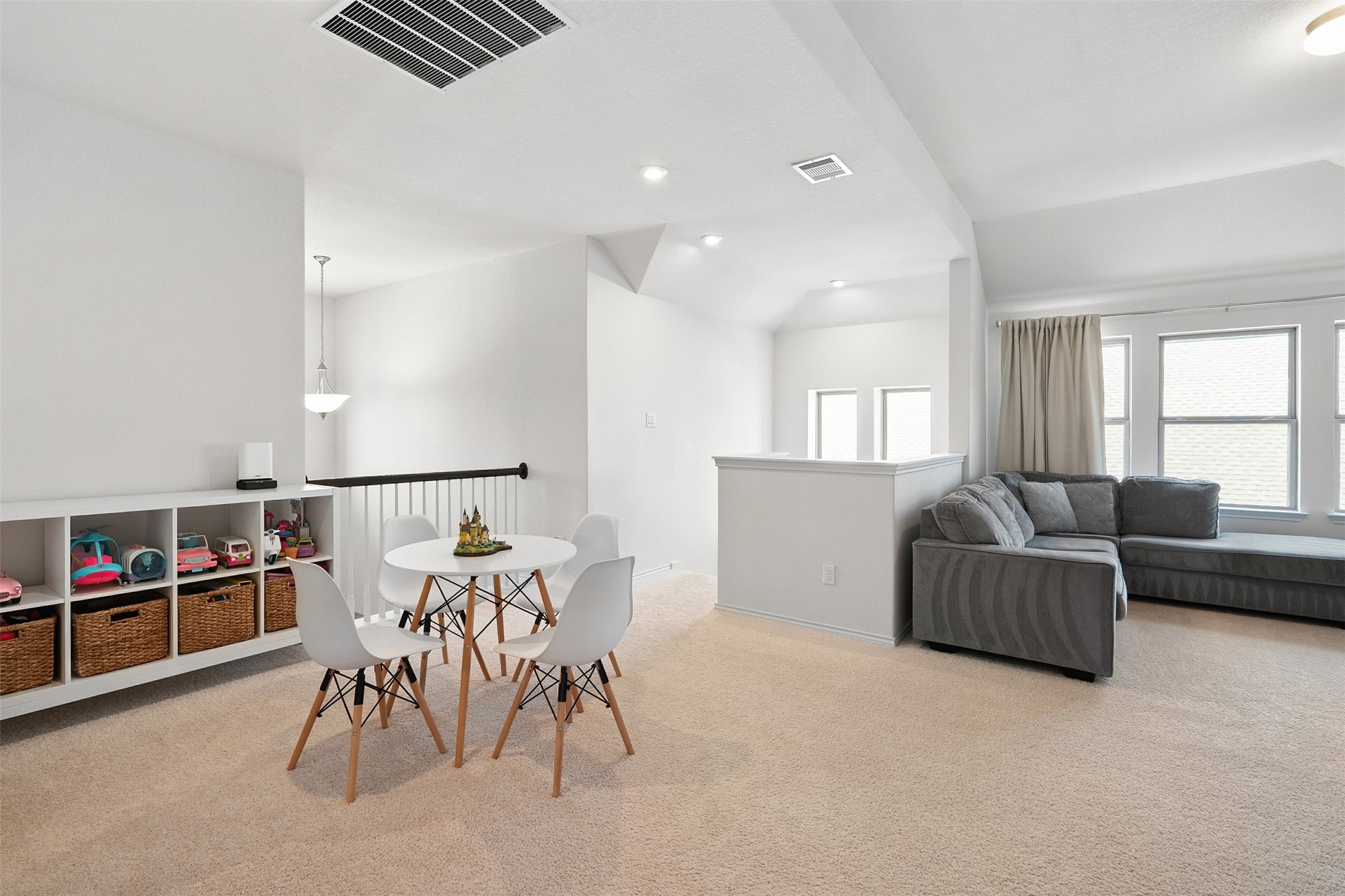 211 Brookside Street Hutto, TX 78634 - Photo 25 of 40 Dining room with light carpet, lofted ceiling, and recessed lighting