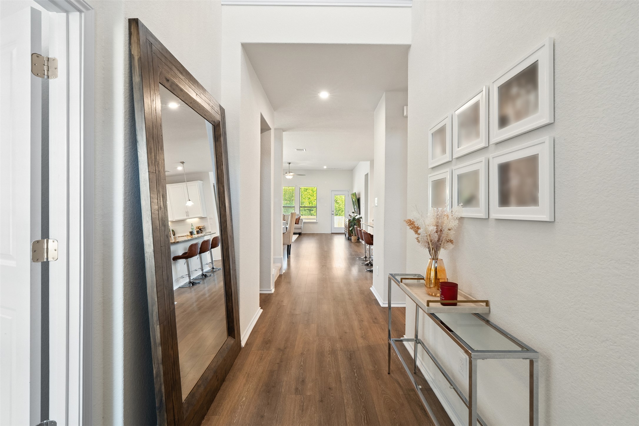 211 Brookside Street Hutto, TX 78634 - Photo 9 of 40 Corridor featuring dark wood-style flooring and recessed lighting