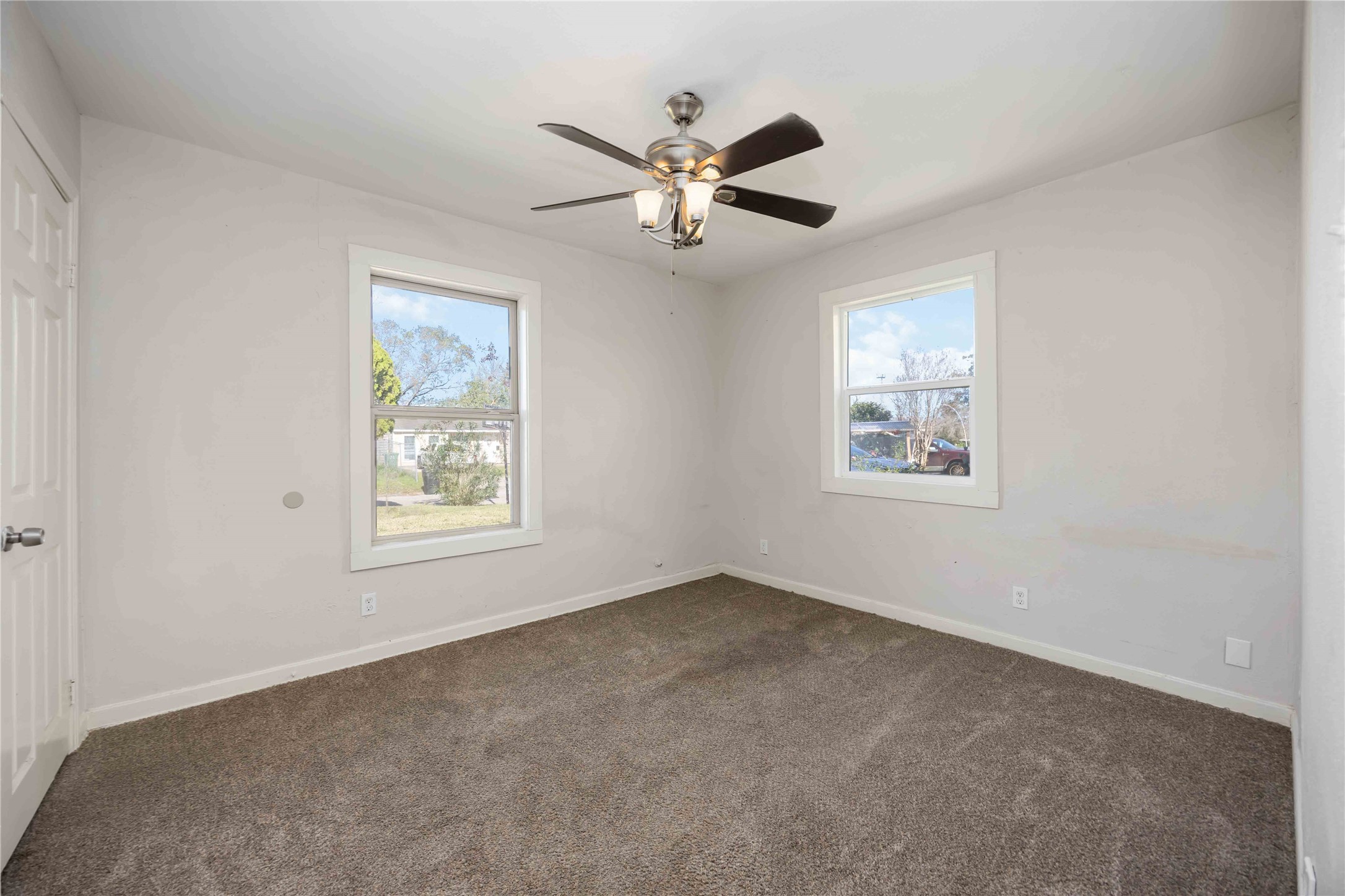 5934 Belcrest Street Houston, TX 77033 - Photo 7 of 17 a view of an empty room with a window