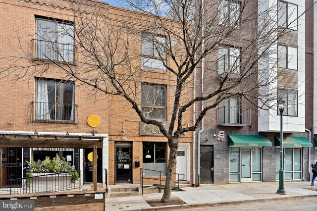 a view of a building with a street