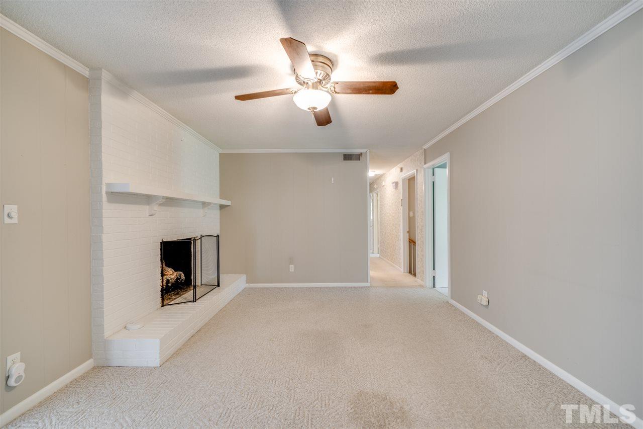 3307 Baugh Street Raleigh, NC 27604 - Photo 7 of 27 a view of an empty room with a fireplace