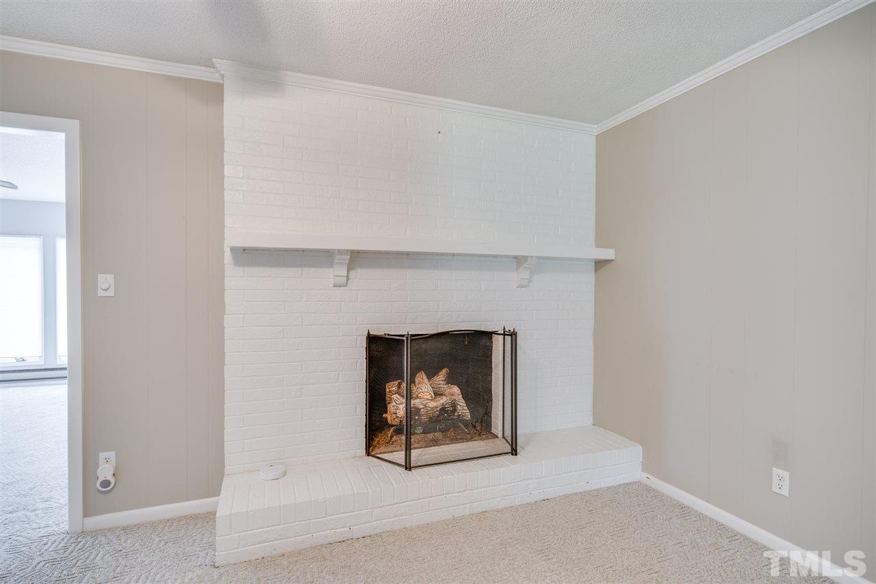 3307 Baugh Street Raleigh, NC 27604 - Photo 8 of 27 a living room with a fireplace