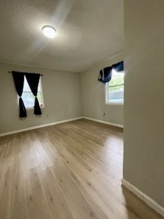 26342 Welch Road Splendora, TX 77372 - Photo 12 of 15 an empty room with wooden floor and windows