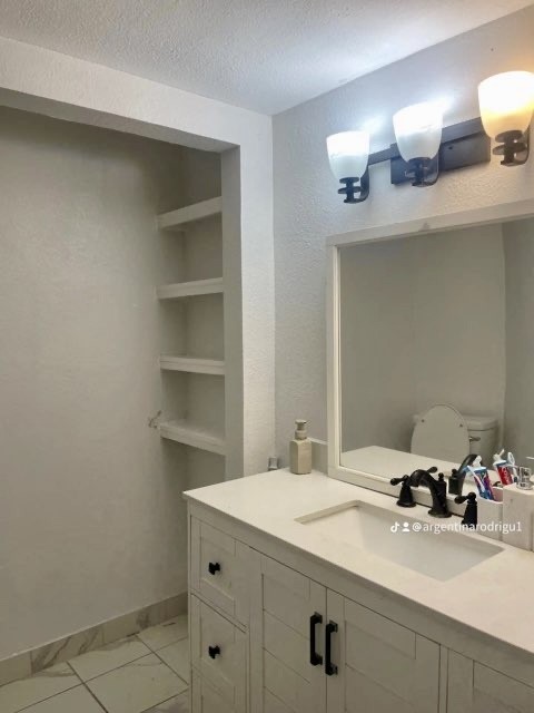 26342 Welch Road Splendora, TX 77372 - Photo 8 of 15 a bathroom with a sink and a mirror