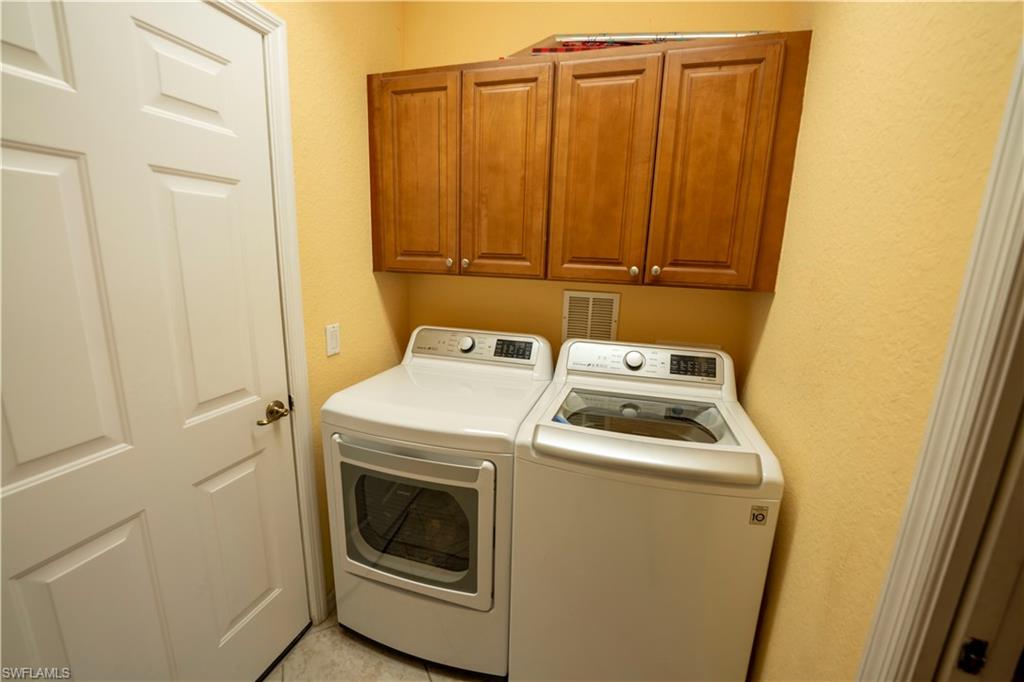 20007 Larino Loop Estero, FL 33928 - Photo 12 of 27 a utility room with dryer and washer