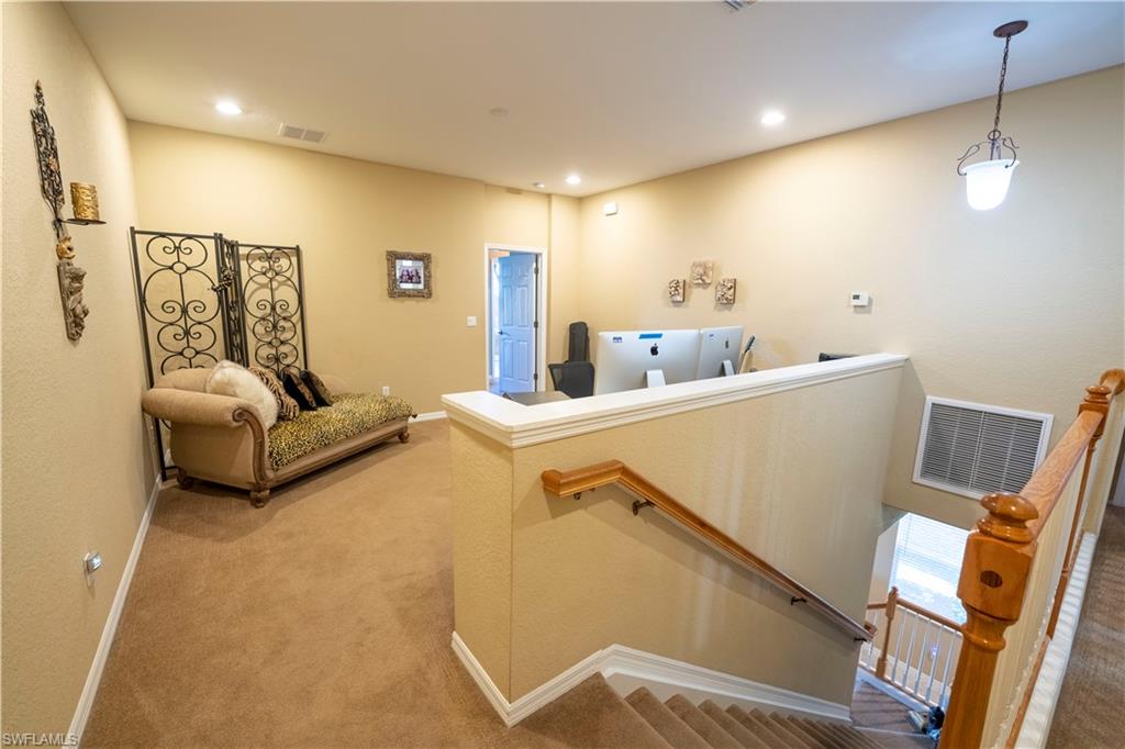 20007 Larino Loop Estero, FL 33928 - Photo 13 of 27 a living room with furniture and a flat screen tv