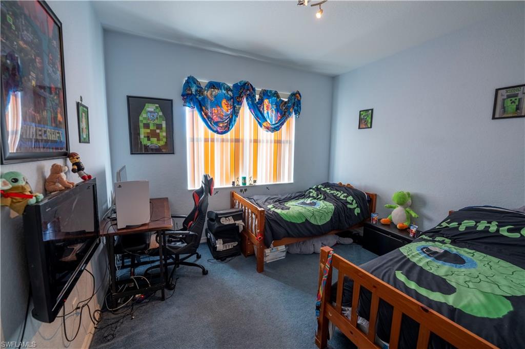 20007 Larino Loop Estero, FL 33928 - Photo 15 of 27 a living room with furniture and a window