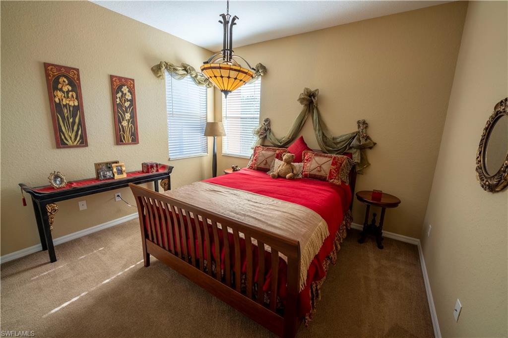 20007 Larino Loop Estero, FL 33928 - Photo 16 of 27 a bedroom with bed and a window