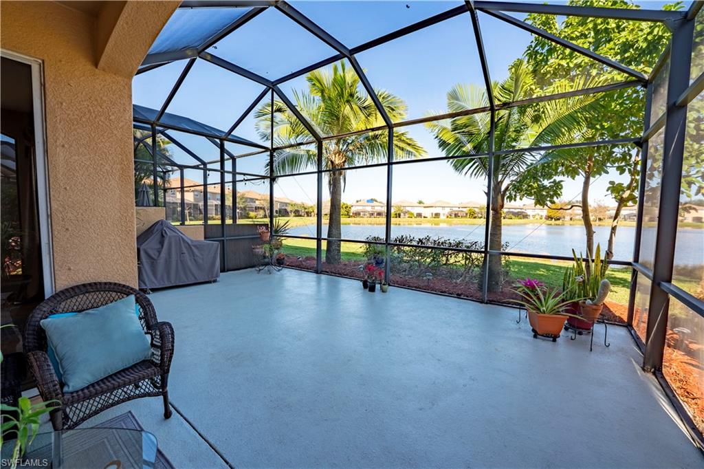 20007 Larino Loop Estero, FL 33928 - Photo 25 of 27 a view of gym equipment and floor to ceiling window