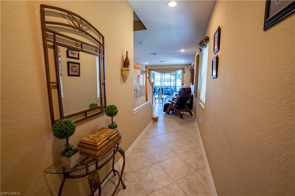 20007 Larino Loop Estero, FL 33928 - Photo 3 of 27 a hallway with a view of living room