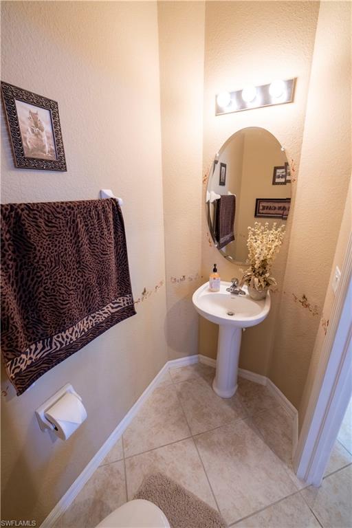 20007 Larino Loop Estero, FL 33928 - Photo 6 of 27 a bathroom with a sink mirror and toilet