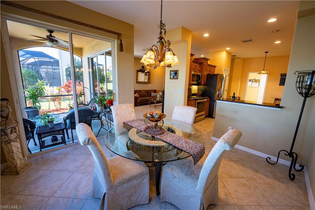 20007 Larino Loop Estero, FL 33928 - Photo 7 of 27 a view of a dining room with furniture window and outside view