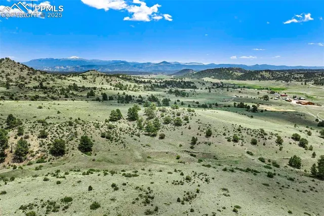 a view of a city with mountains in the background