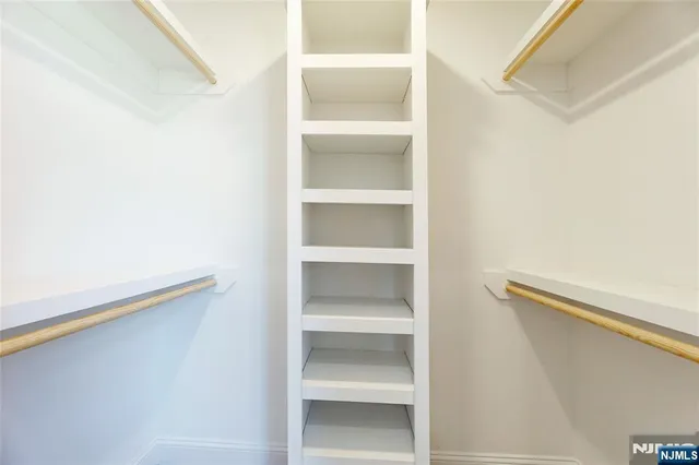 a view of room with window and ceiling fan